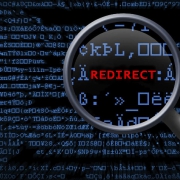 Random binary data with magnifying glass showing the text REDIRECT in red