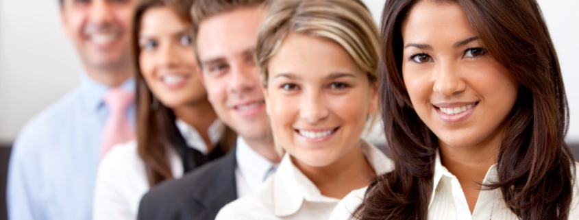 Men and women standing in a line dressed in business clothing